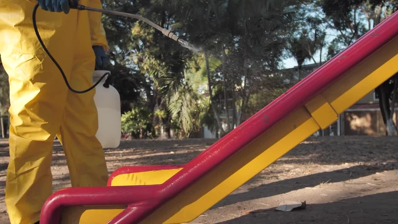 Stock Footage Worker Disinfecting Areas Of A Playground Live Wallpaper Free