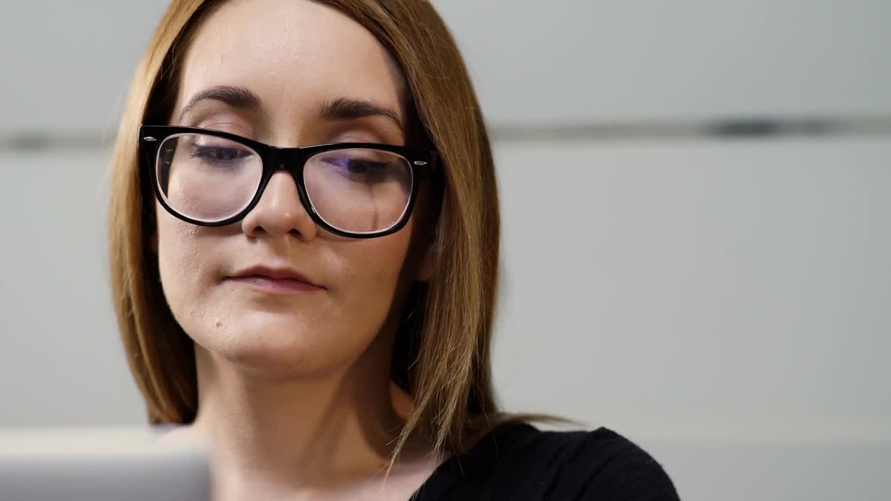 Stock Footage Young Woman With Glasses Working On Her Laptop Live Wallpaper Free