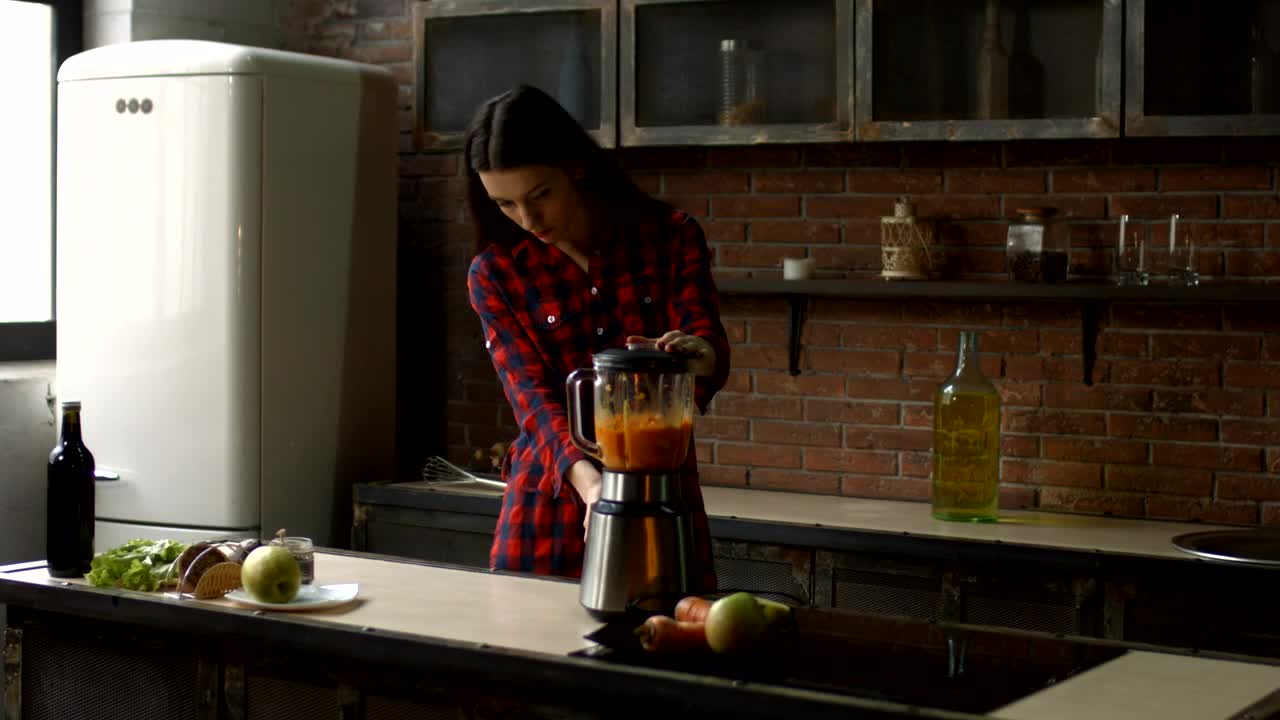 Stock Footage Young Woman Preparing A Smoothie In A Kitchen Live Wallpaper Free
