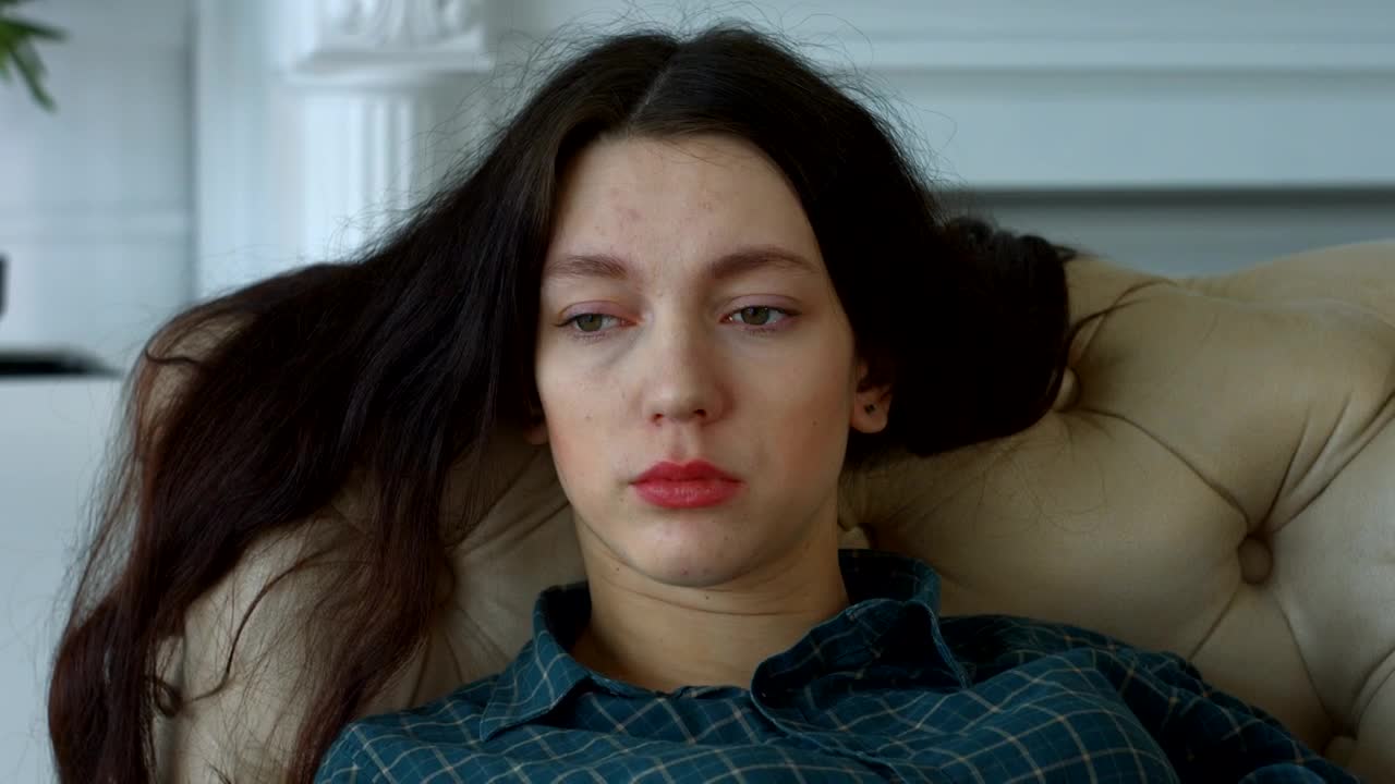 Stock Footage Worried Woman Sitting In An Armchair Live Wallpaper Free