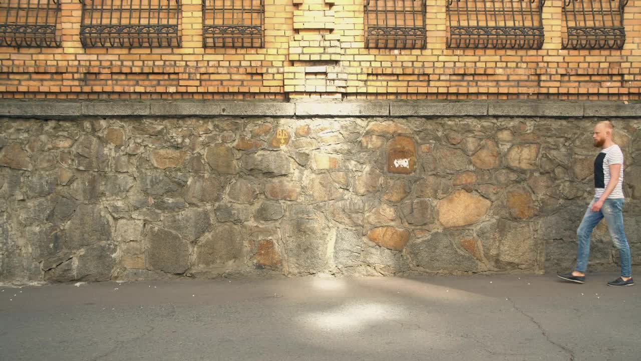Stock Footage Young Bearded Man Walking Down The Street Live Wallpaper Free