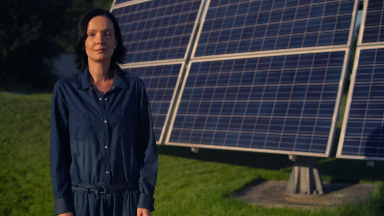 Stock Footage Woman Standing In Front Of A Solar Panel Live Wallpaper Free
