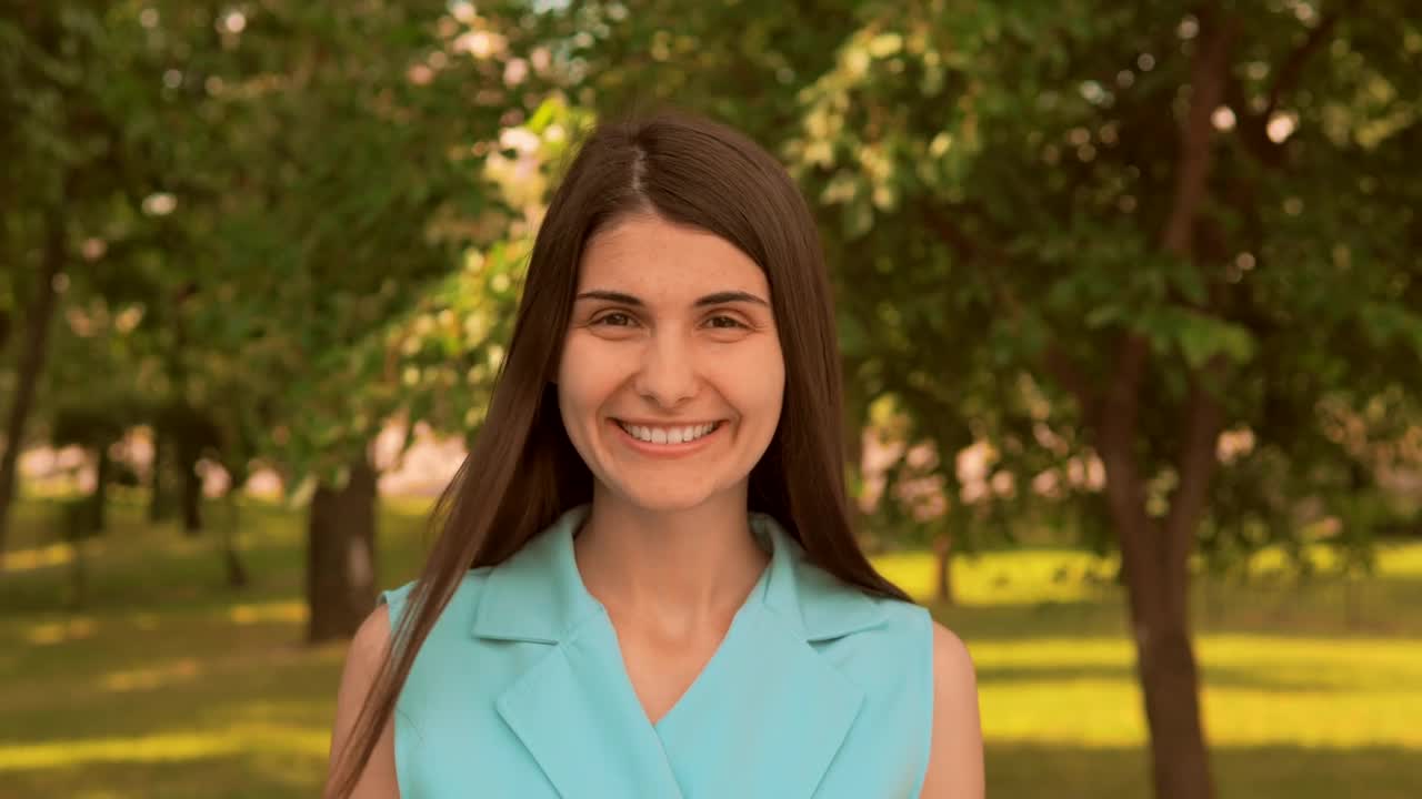 Stock Footage Woman Smiling Head On In A Beautiful Park Live Wallpaper Free