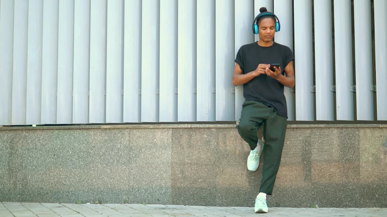 Stock Footage Young Man Snaps His Fingers Listening To Music Live Wallpaper Free