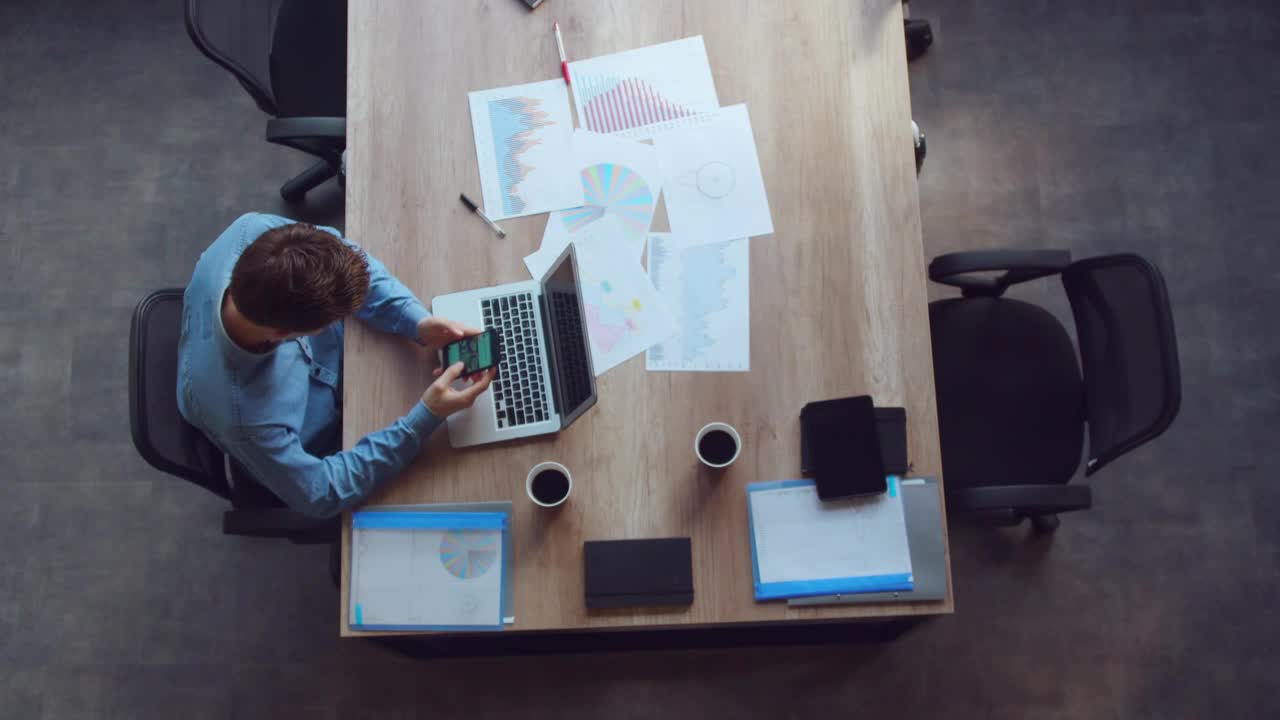 Stock Footage Young Man Sitting Scrolling On His Cell Phone Live Wallpaper Free