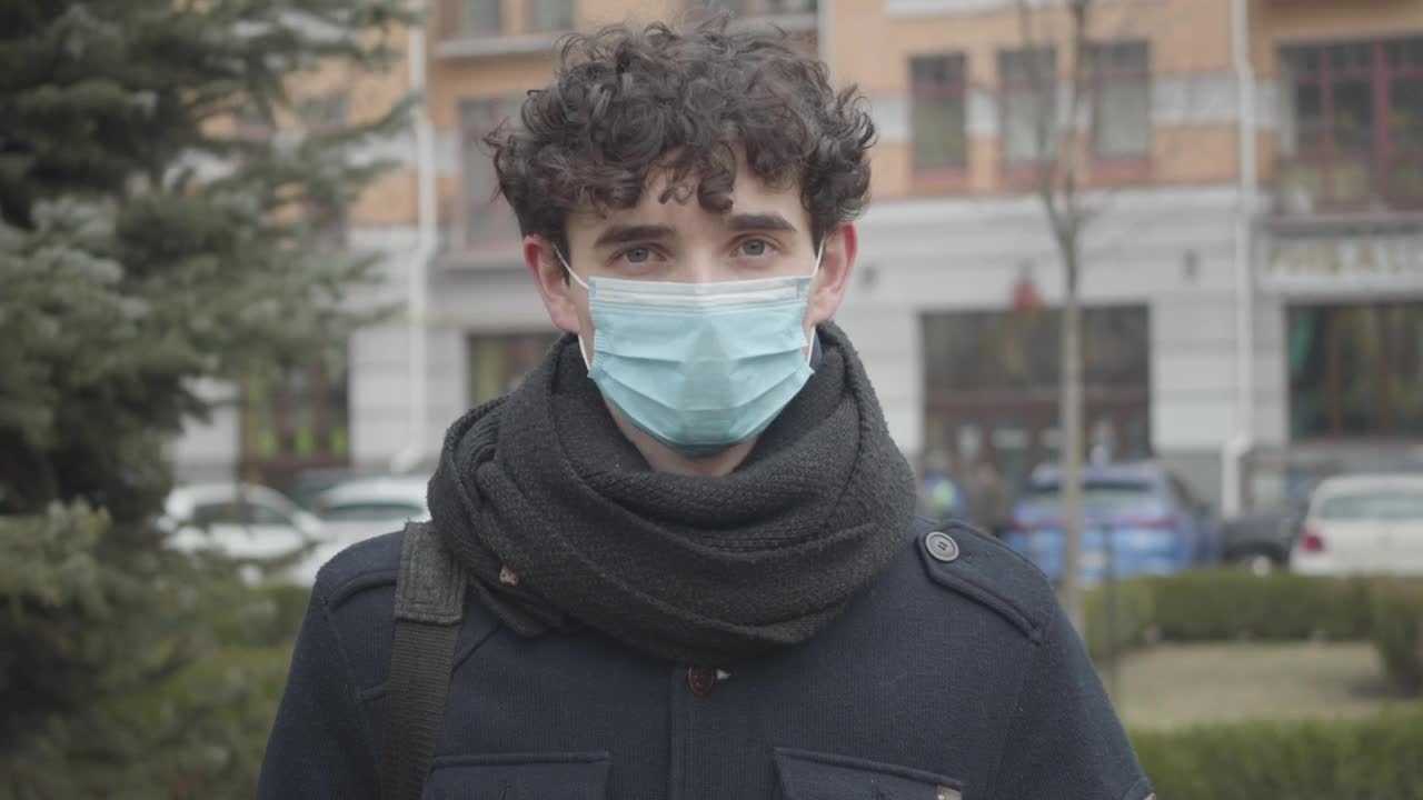 Stock Footage Young Man With Face Mask On The Street Live Wallpaper Free