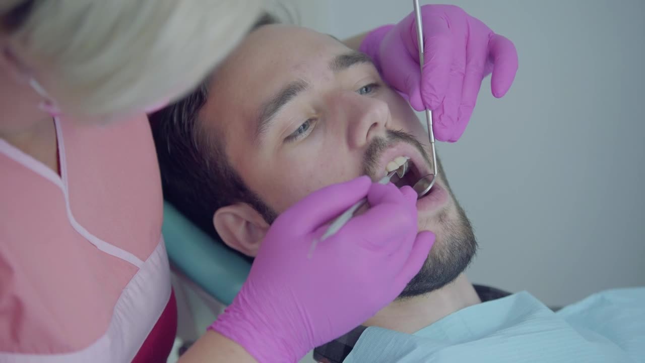 Stock Footage Young Man In Consultation With The Dentist Live Wallpaper Free