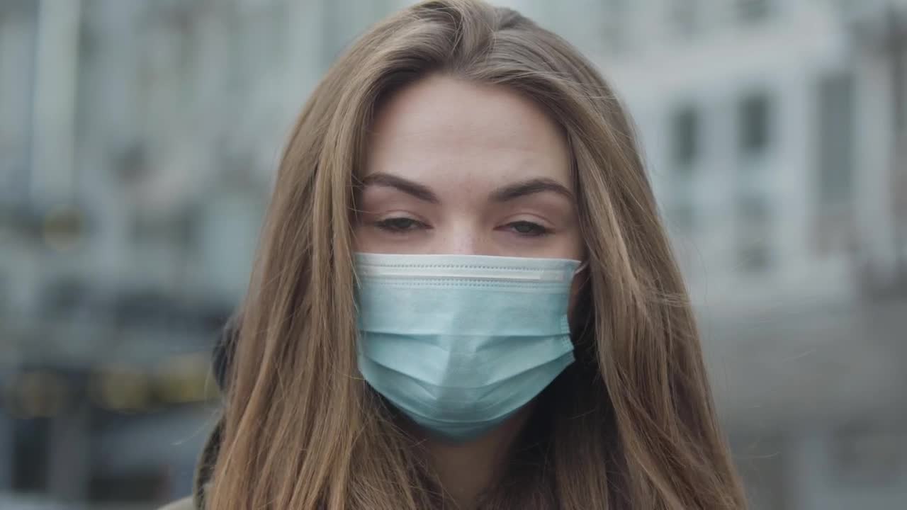 Stock Footage Woman Looking At The Camera With A Mask Live Wallpaper Free