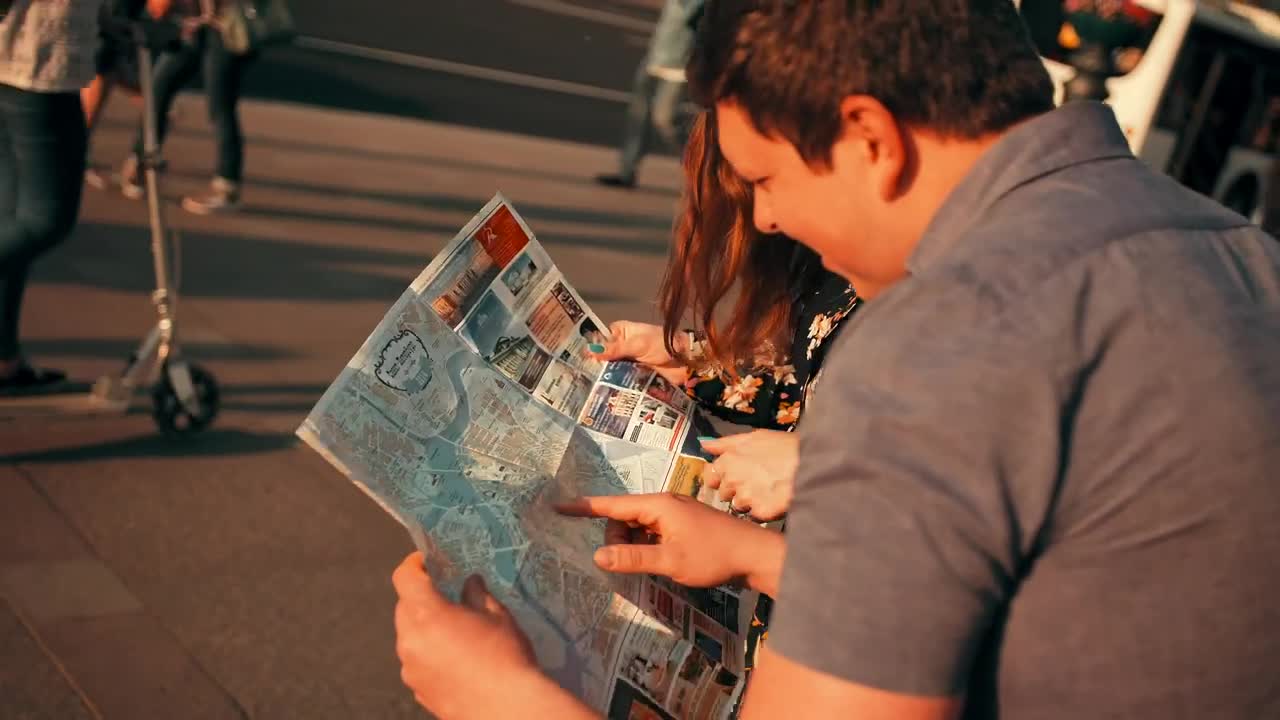 Stock Footage Young Tourists Locating Themselves On A Map Live Wallpaper Free