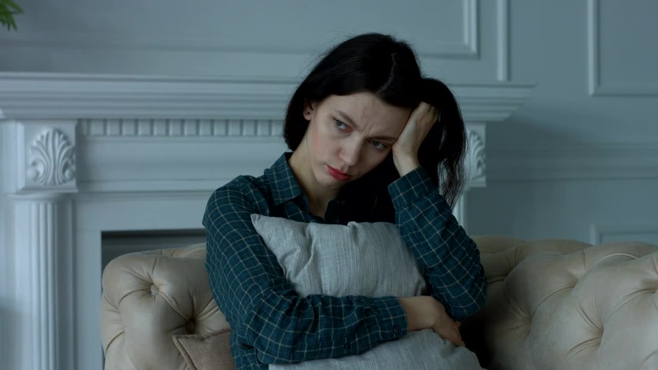 Stock Footage Worried And Sad Woman Hugging A Cushion Live Wallpaper Free