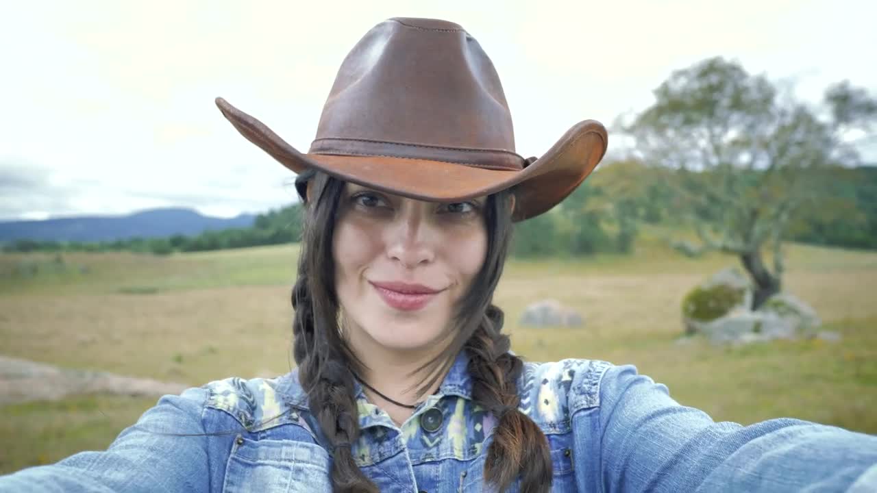 Stock Footage Woman Making Faces At The Camera With A Countryside Background Live Wallpaper Free