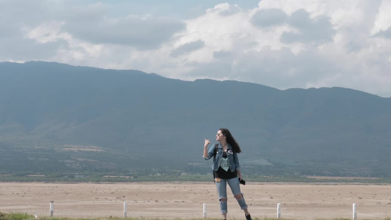 Stock Footage Woman Hitchhiking By The Road Live Wallpaper Free
