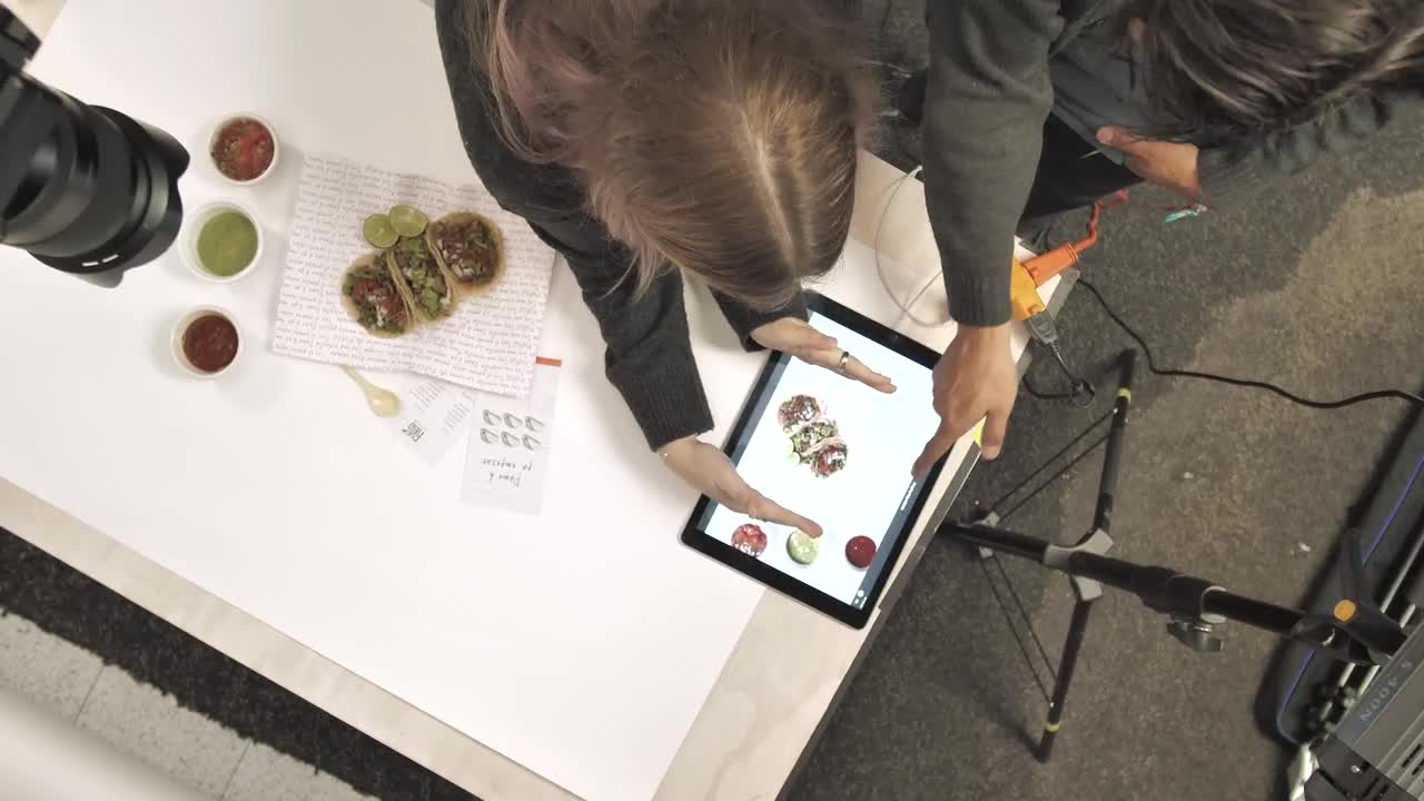 Stock Footage Young People Reviewing A Studio Photograph Live Wallpaper Free