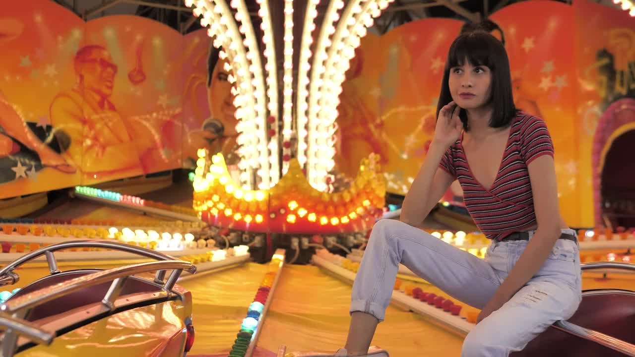 Stock Footage Woman Sitting On A Bright Fair Game Live Wallpaper Free