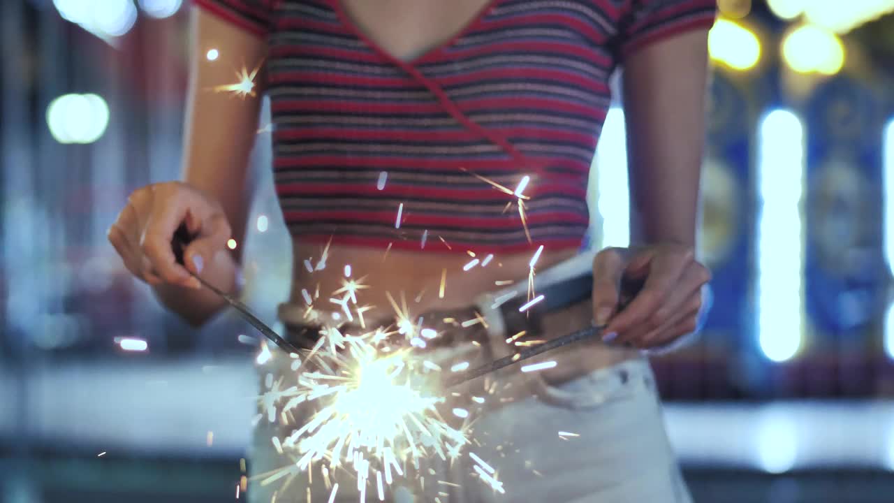 Stock Footage Woman Holding A Sparklers At The Fair Live Wallpaper Free