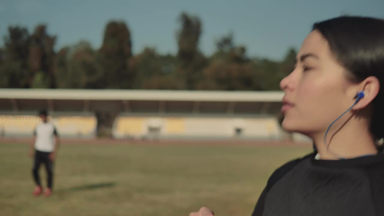 Stock Footage Woman Taking Off Her Headphones While Walking Live Wallpaper Free