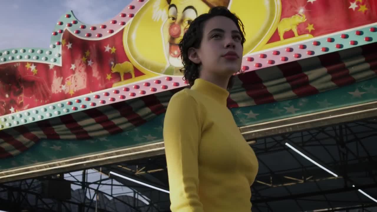Stock Footage Woman Walking In Front Of Mechanical Rides Live Wallpaper Free