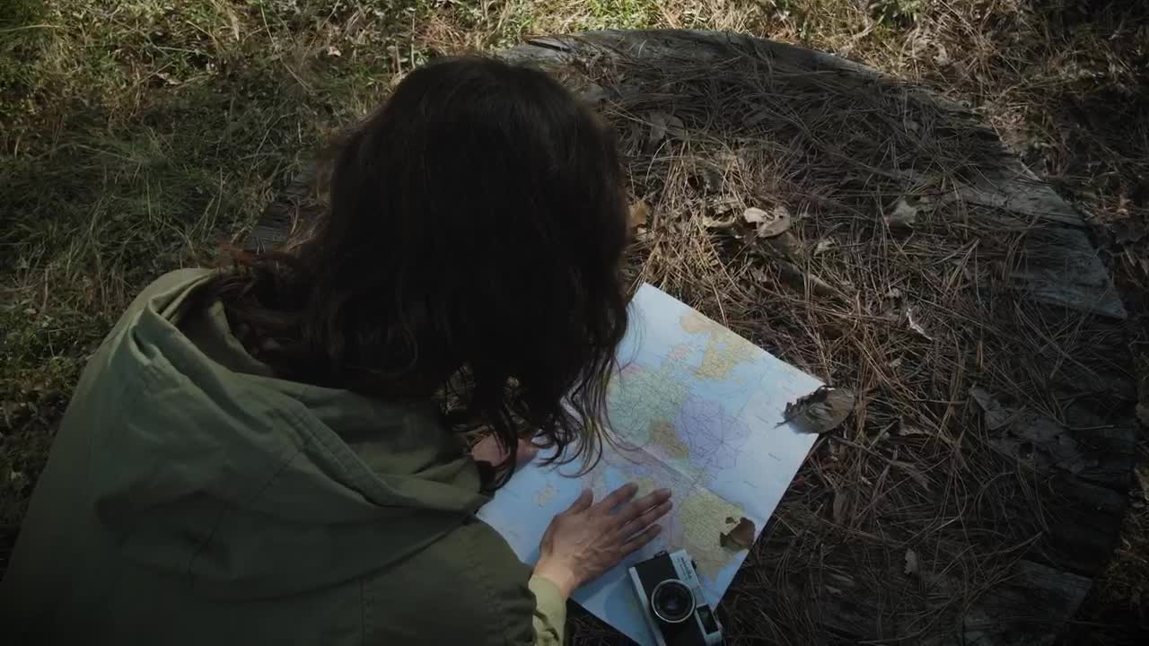 Stock Footage Woman Reading A Map In The Forest Live Wallpaper Free