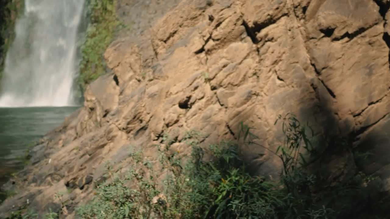 Stock Footage Woman Standing In Front Of Waterfall On A Sunny Day Live Wallpaper Free
