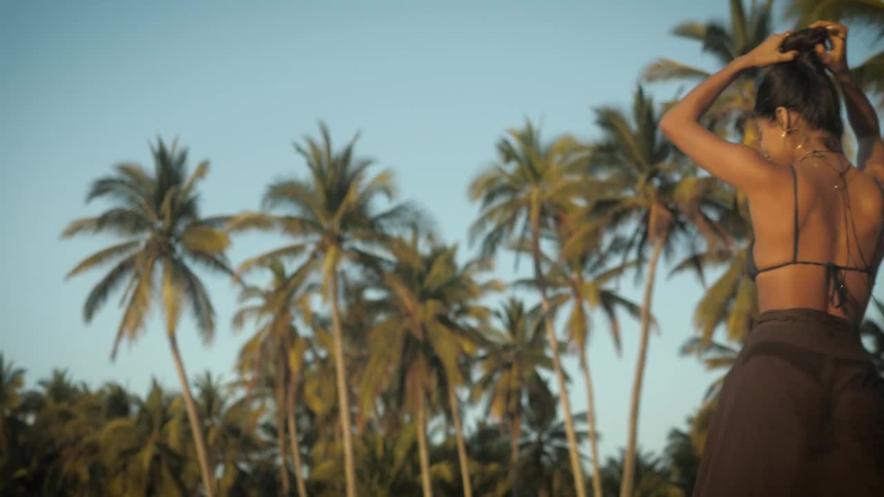 Stock Footage Woman Walking In Front Of Palm Trees Live Wallpaper Free