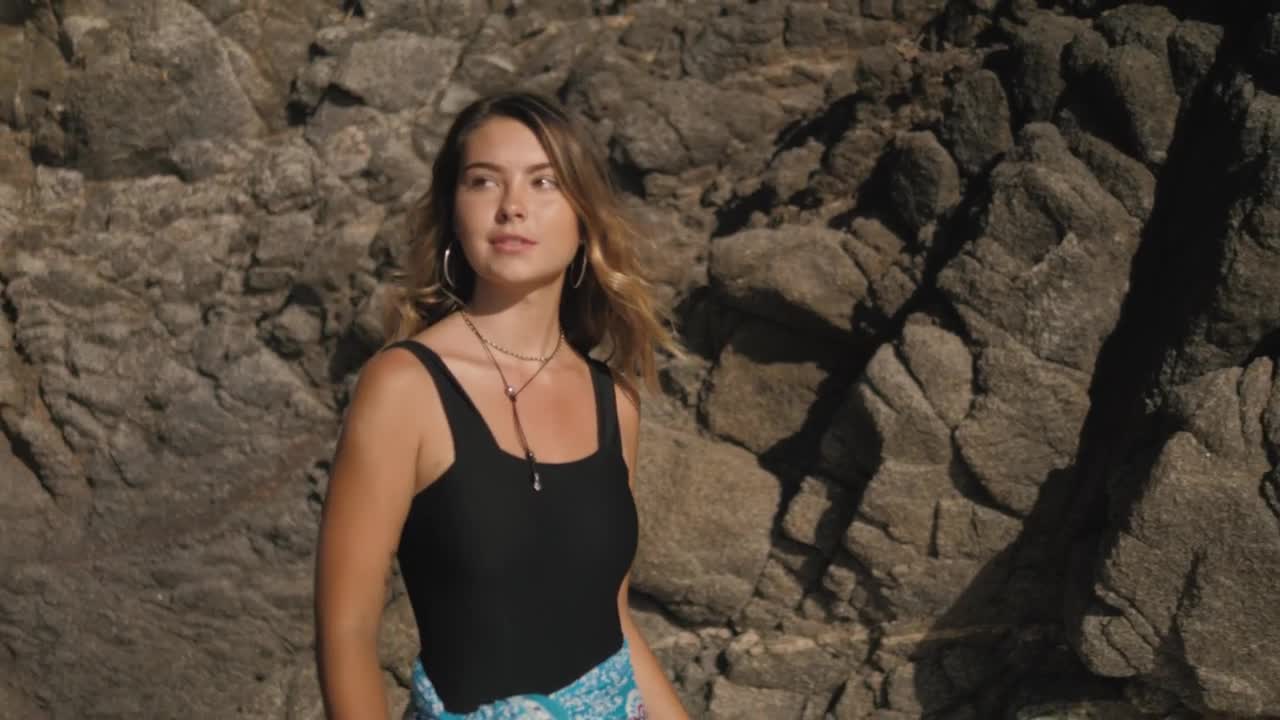 Stock Footage Woman Removes Wrap On The Beach Live Wallpaper Free