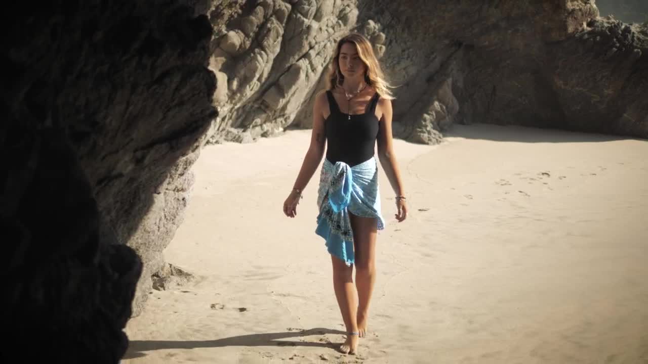 Stock Footage Woman Walks Into Cave On The Beach Live Wallpaper Free