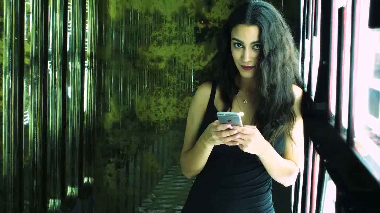 Stock Footage Woman Texting In A Club Entrance Live Wallpaper Free