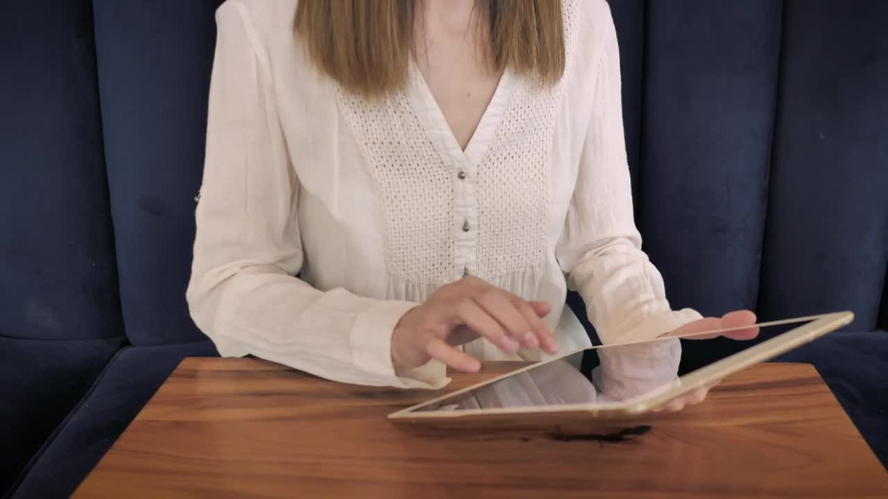 Stock Footage Woman Using A Tablet On The Couch Live Wallpaper Free