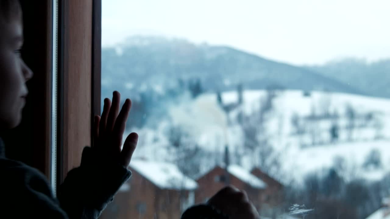 Stock Video A Boy Draws Imaginary Shapes On Window Live Wallpaper for PC