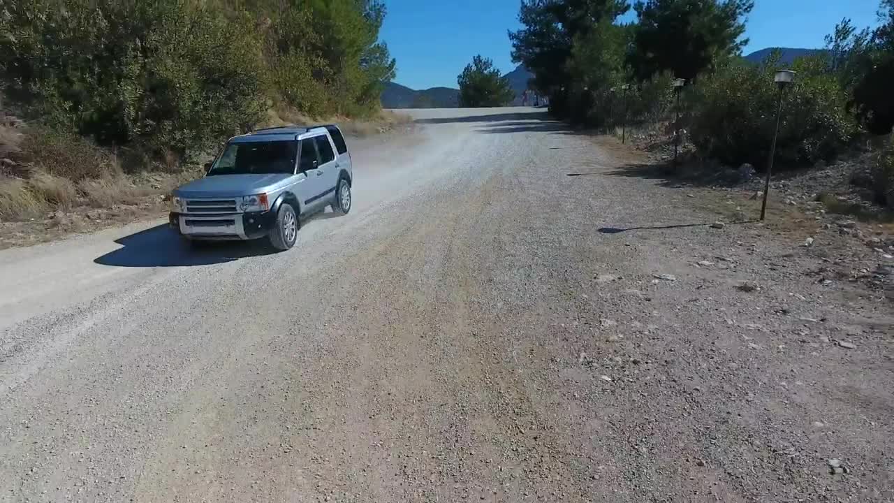Stock Video A Car Traveling On The Road By The Lake Live Wallpaper for PC