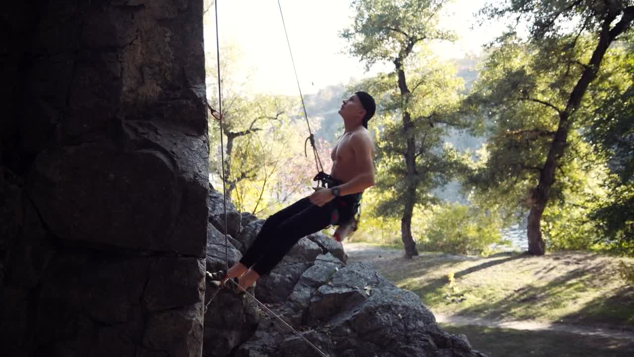 Stock Video A Climber Testing The Ropes On The Rock Live Wallpaper for PC