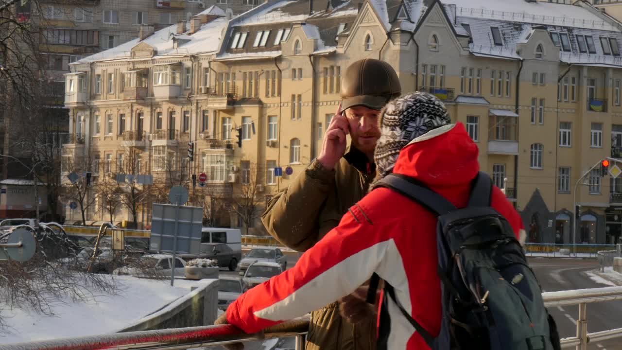 Stock Video A Couple Of Men Talking On The Street Live Wallpaper for PC
