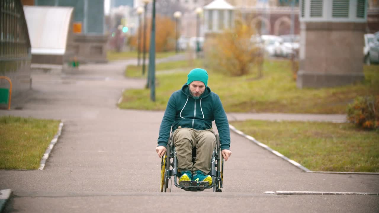 Stock Video A Disabled Man Makes Failed Attempt To Steer His Wheelchair Live Wallpaper for PC