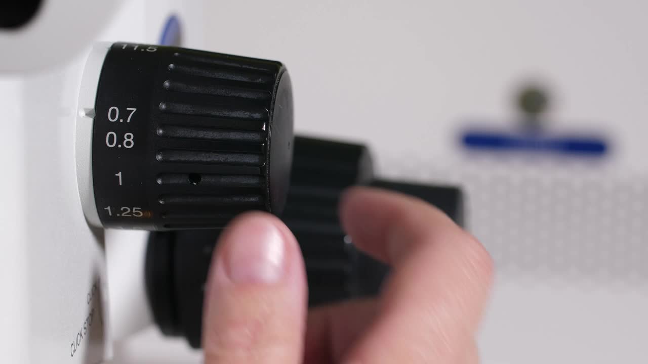 Stock Video Adjusting The Zoom On A Microscope Live Wallpaper for PC