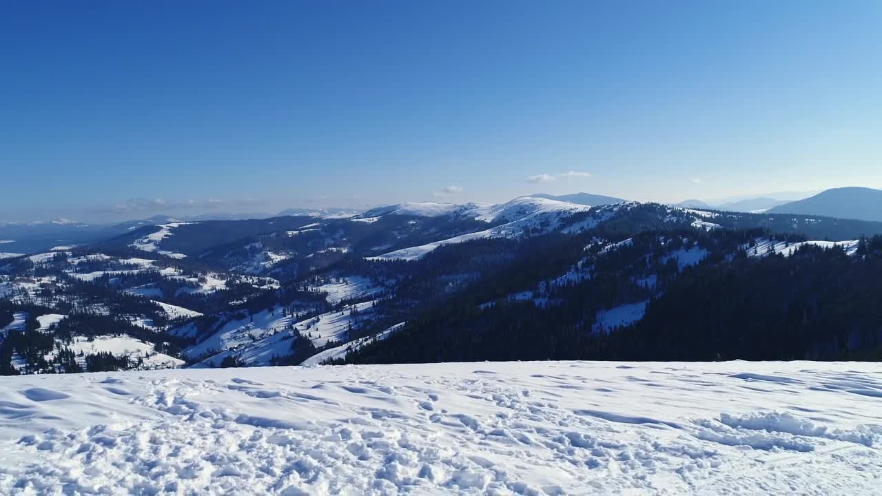 Stock Video Aerial Shot From The Top Of A Snowy Mountain Live Wallpaper for PC