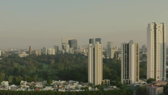 Stock Video Aerial Shot Of A Large City Surrounding A Huge Park Live Wallpaper for PC