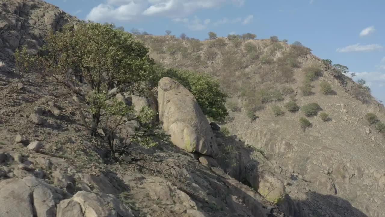 Stock Video Aerial Tour Over An Arid And Rocky Mountain Range Live Wallpaper for PC