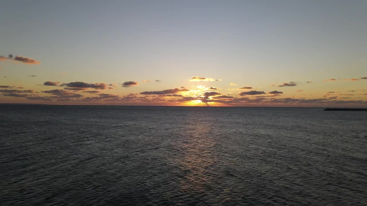 Stock Video Aerial Zoom Out Shot Of The Sea At Sunset Live Wallpaper for PC