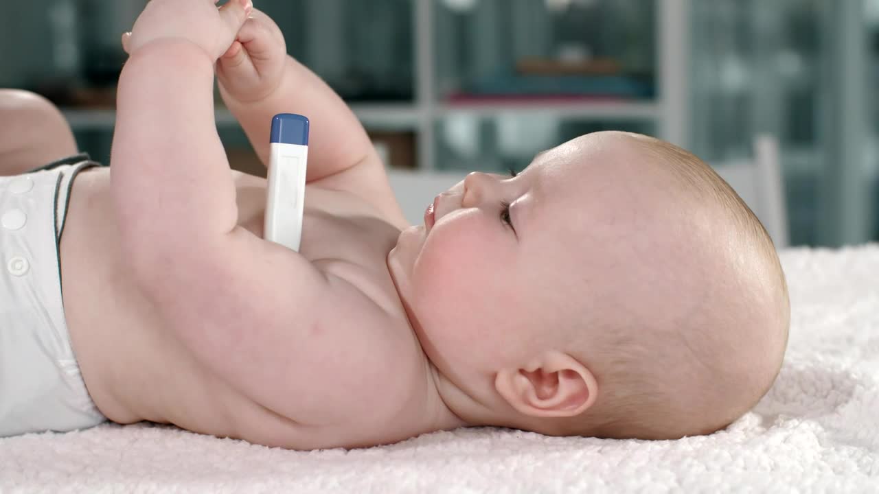 Stock Video Baby Lying With A Thermometer In His Arm Live Wallpaper For PC