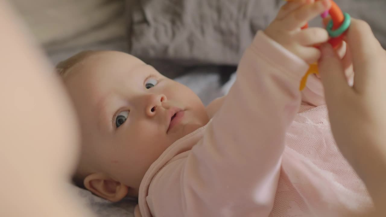 Stock Video Baby Holding A Plastic Toy Live Wallpaper For PC