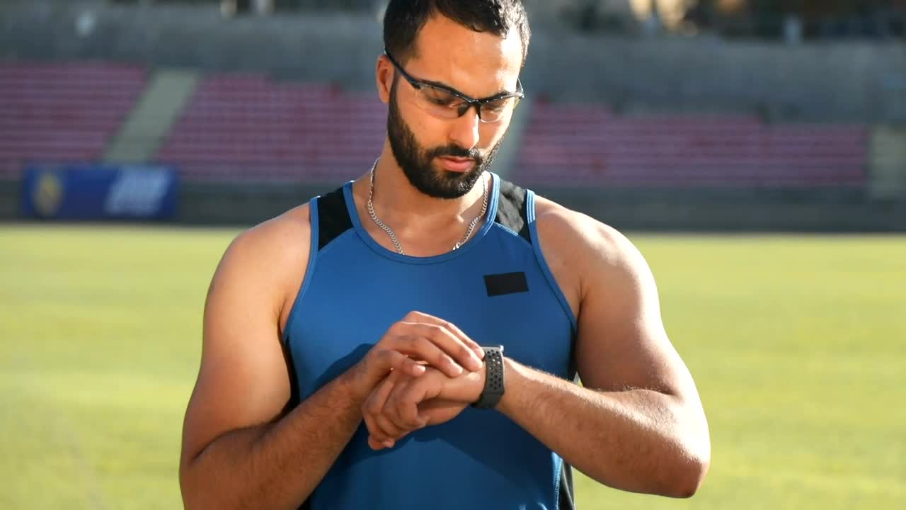 Stock Video Athlete Checks Timer Before Run Live Wallpaper For PC