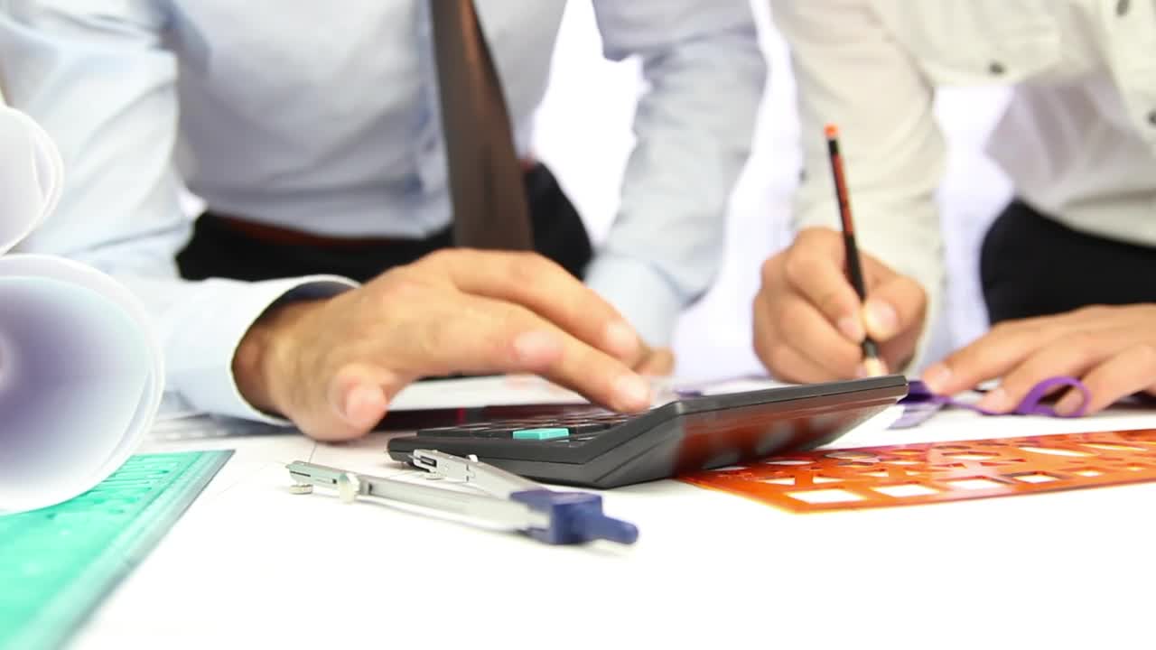 Stock Video Architects Working With A Calculator In A Desk Live Wallpaper For PC