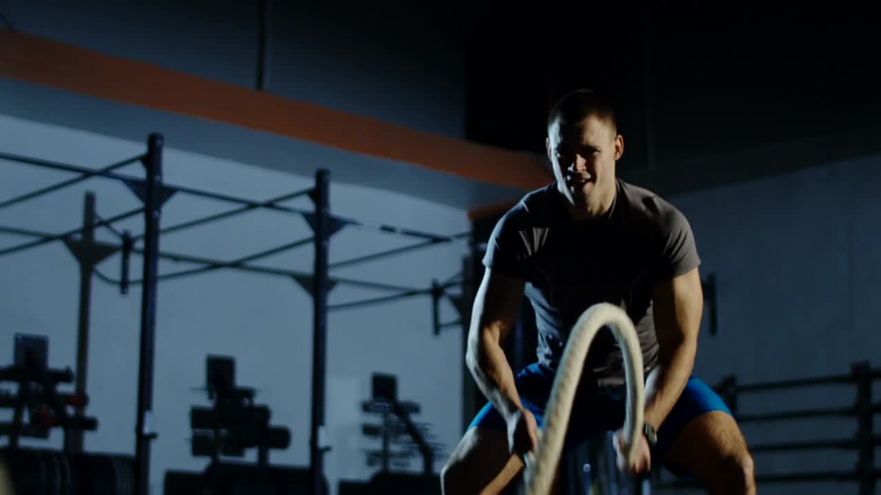 Stock Video An Athlete Using Thew Ropes In The Gym Live Wallpaper For PC