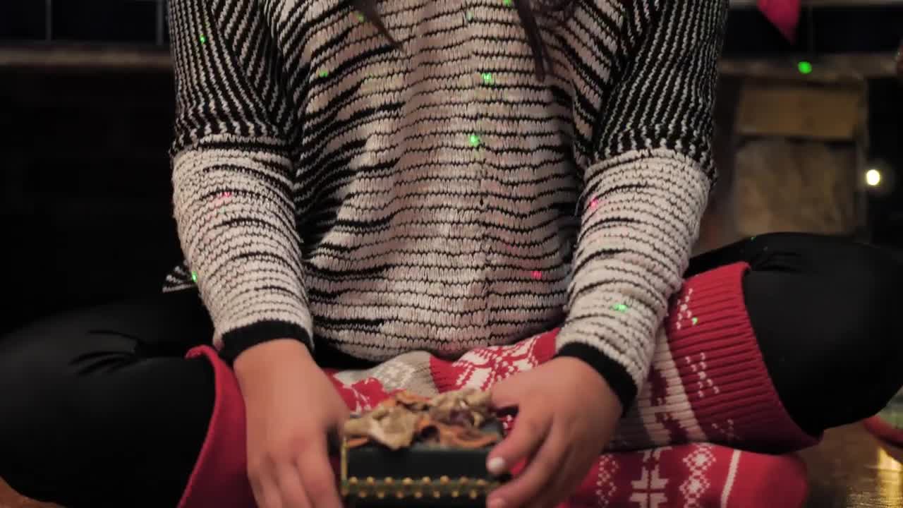 Stock Video A Young Woman Opens A Christmas Present Live Wallpaper For PC