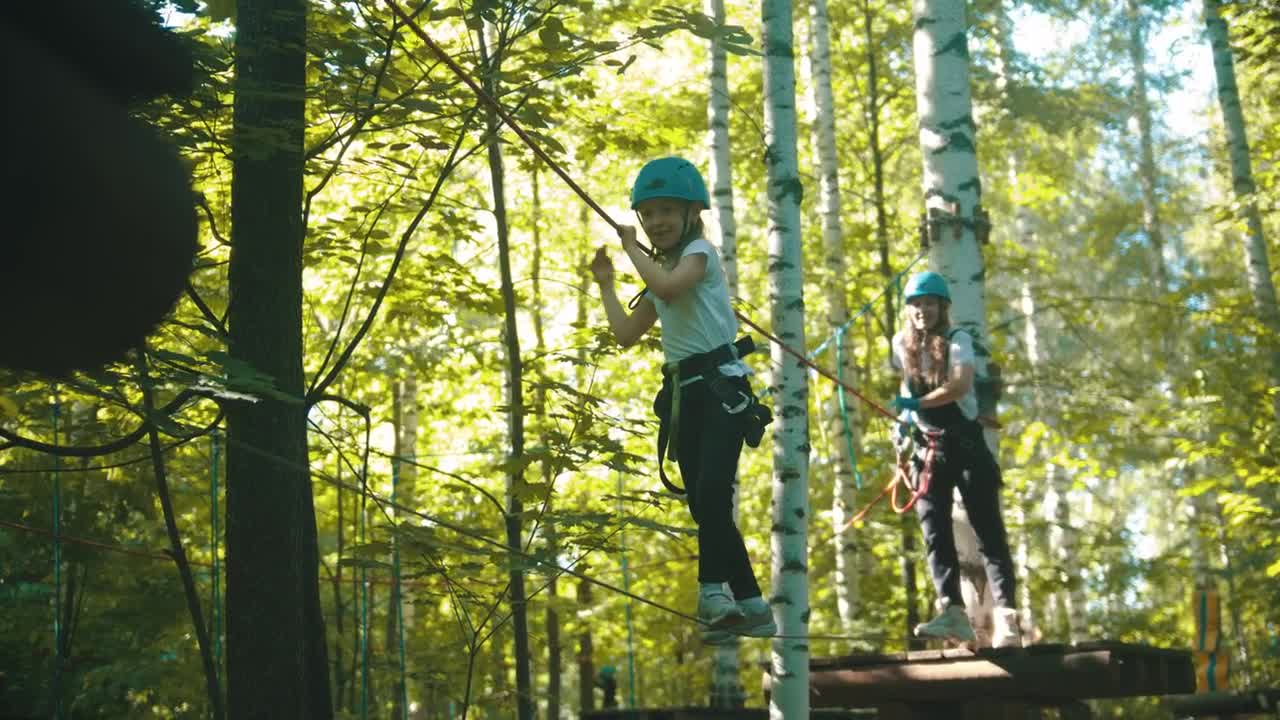 Stock Video A Young Woman And Her Daughter Crossing On A Rope Live Wallpaper For PC