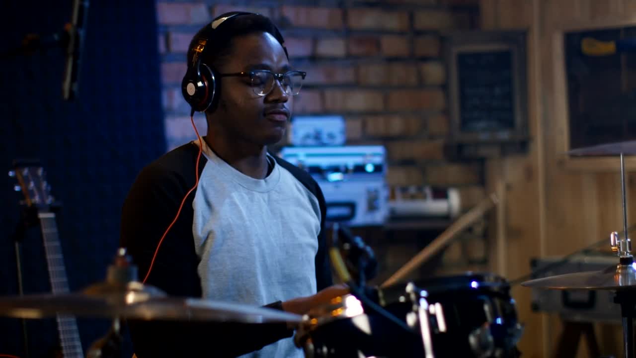Stock Video A Young Man With Headphones Playing The Drums Live Wallpaper For PC