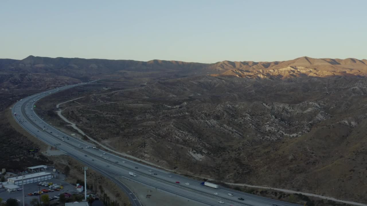 Stock Video A Road That Surrounds An Area Of Small Mountains Live Wallpaper For PC