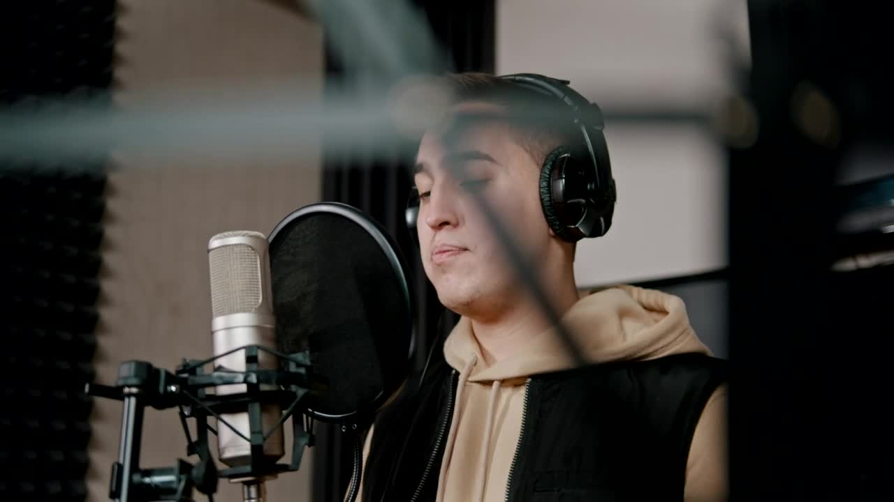 Stock Video A Rapper With Headphones Recording In The Studio Live Wallpaper For PC