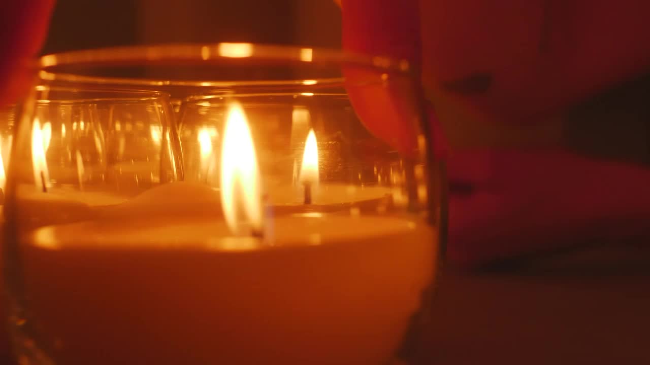 Stock Video A Persons Hand Accommodating Small Candles Live Wallpaper For PC