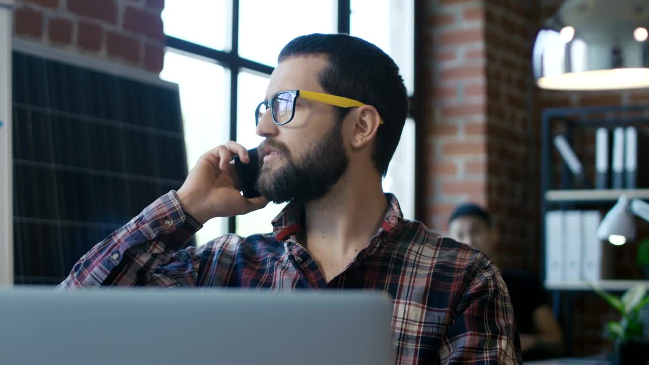Stock Video A Man With Glasses Speaking On The Phone Live Wallpaper For PC